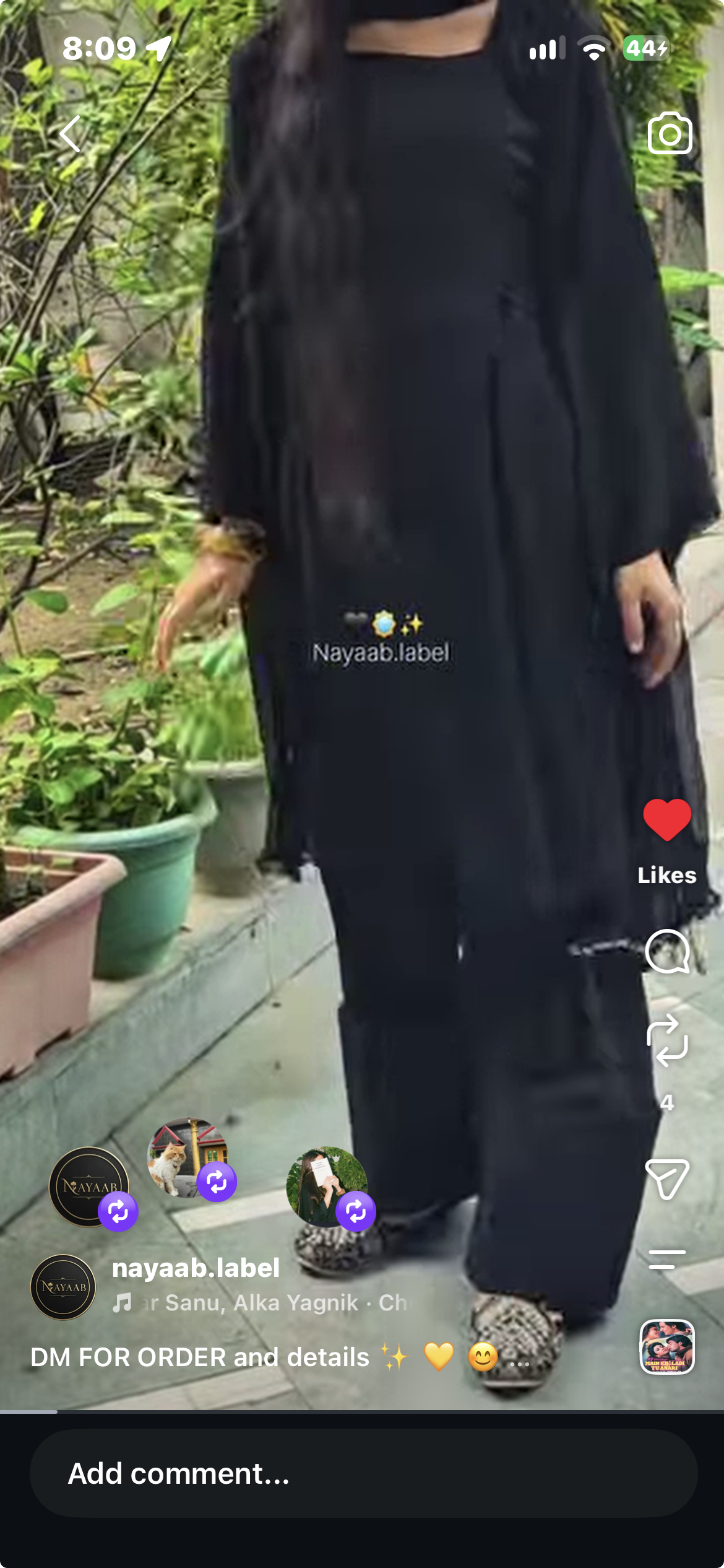 Nayaab black suit with a relaxed kurta, wide trousers and matching dupatta